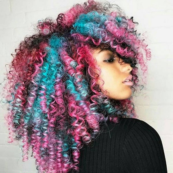 Black woman with beautiful rainbow coloured curly hair